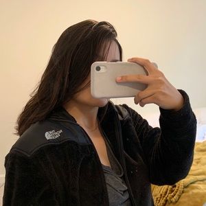 Black fuzzy fleece North Face jacket
